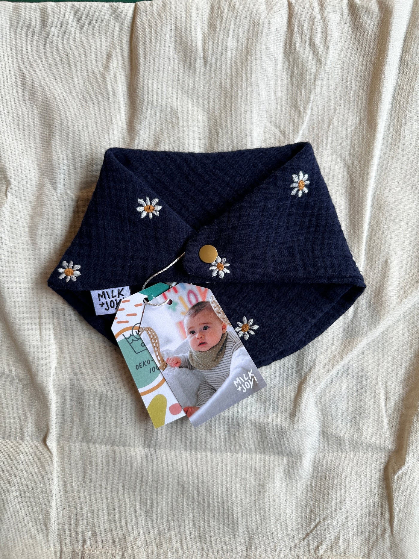 Navy Embroidered Daisy Bib | Milk & Joy