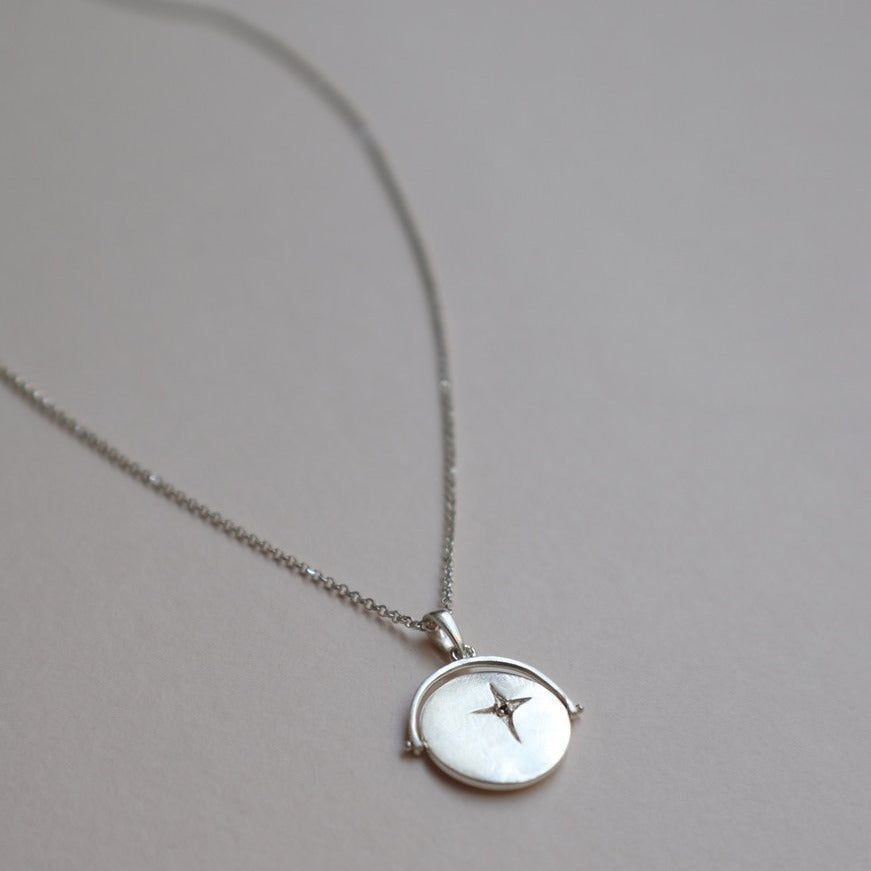 silver spinner necklace