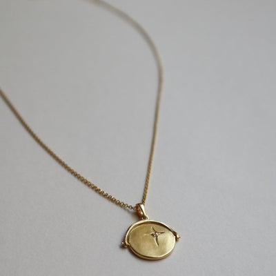 gold spinner necklace